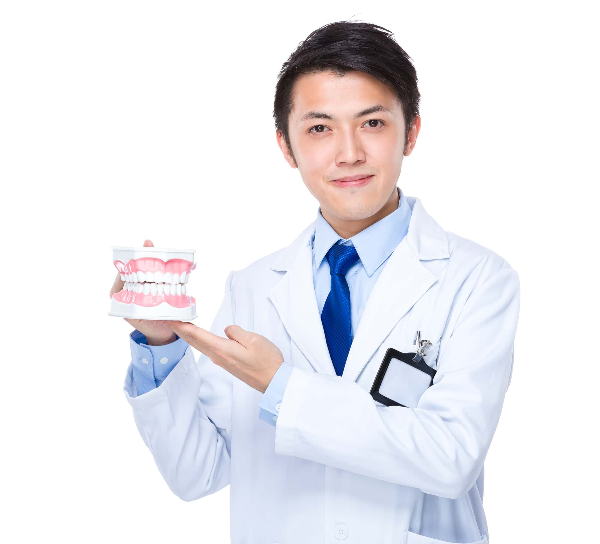 入れ歯が外れる原因について説明する歯科医